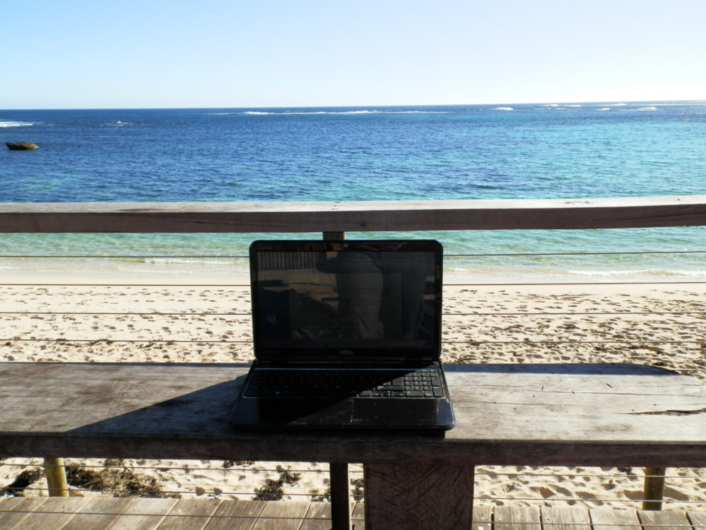 laptop by the sea